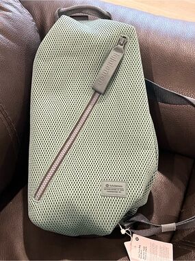 NWT Lululemon large sage green Mesh Sling Bag